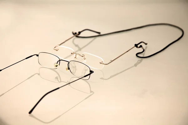 Two pair of eye glasses with reflection — Stock Photo, Image