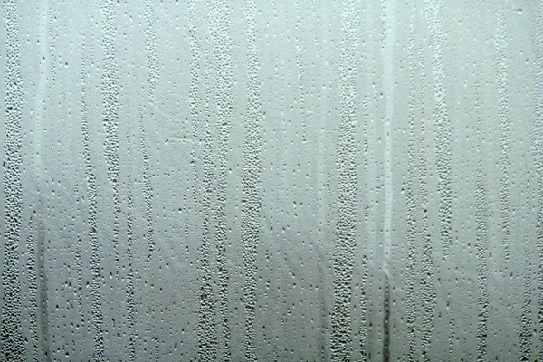 Water patronen op venster — Stockfoto