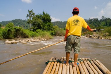 Bamboo Rafting in Thailand clipart