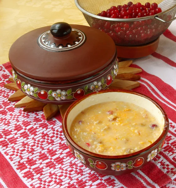 Corn porridge (banush) with a cranberry — Stock Photo, Image