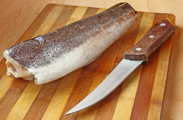 A hake is silvery on a table — Stock Photo, Image