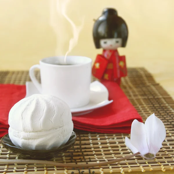 stock image White day. Zephyr with the cup of coffee and doll in the Japanes