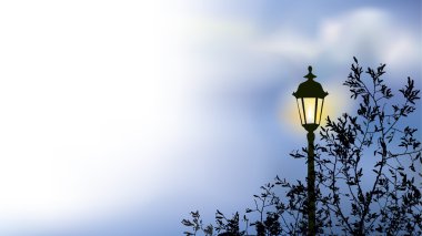 Glowing lantern near the branches of spring tree clipart