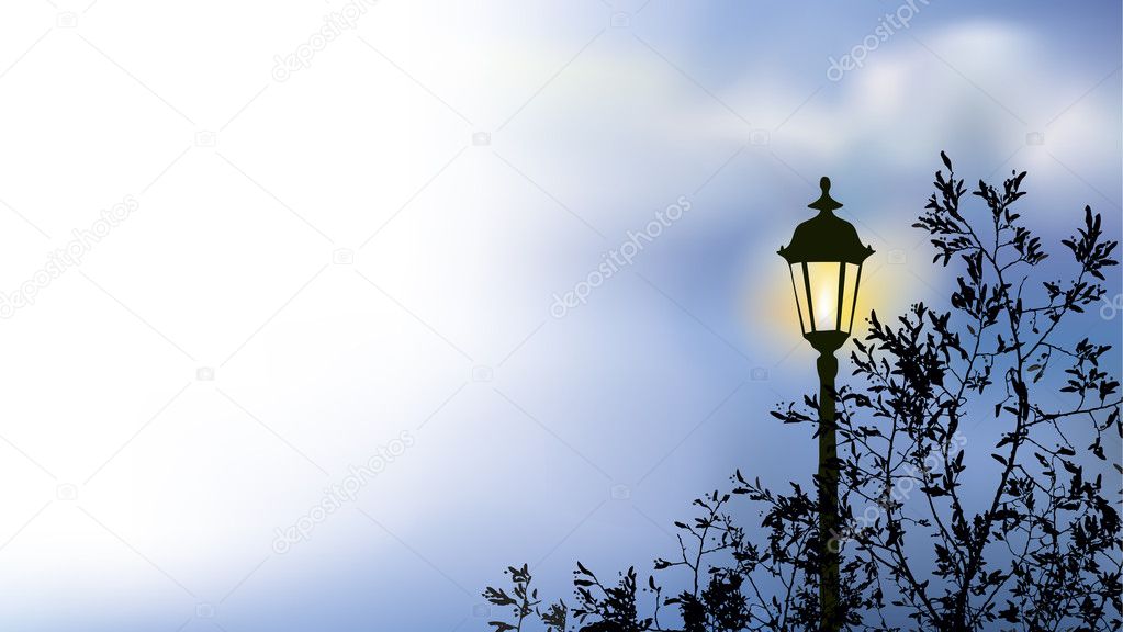 Glowing lantern near the branches of spring tree