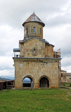 One little church of old orthodox monastery Gelati near Kutaisi - Georgia. clipart