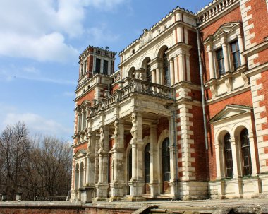 Facade of the old estate built in classical style clipart