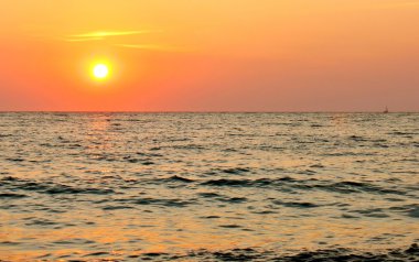 Sun set over the sea horizon clipart