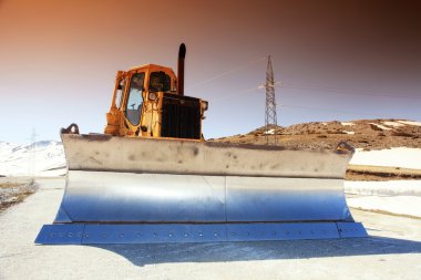 Snow-cleaning bulldozer clipart