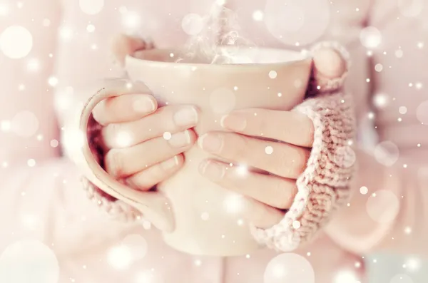 Hands of woman holding a cup — Stock Photo, Image