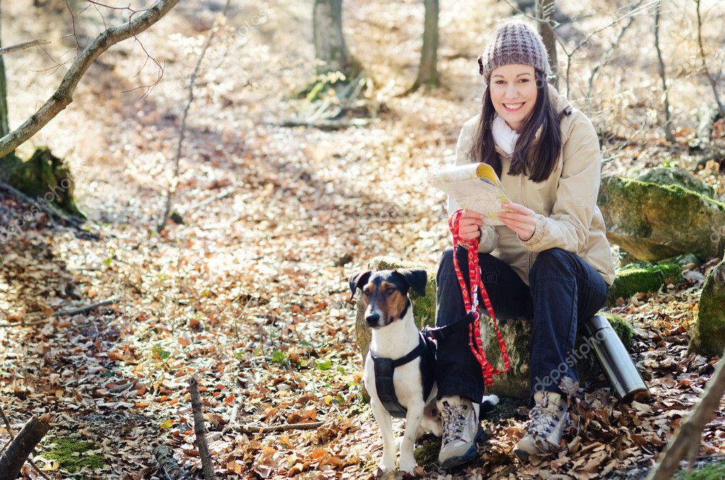 Woman hiking with dog — Stock Photo © loriklaszlo 9475954