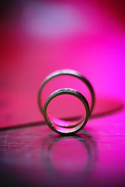 Beautiful union of wedding golden rings — Stock Photo, Image