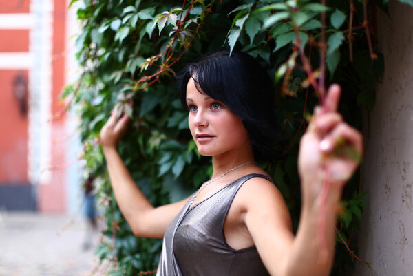 Cute girl is holding ivy