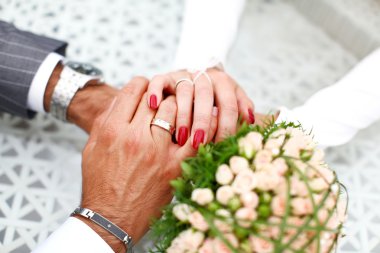 Bride and groom hand in hand together clipart