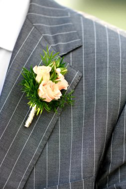 Beautiful wedding boutonniere at groom's costume clipart