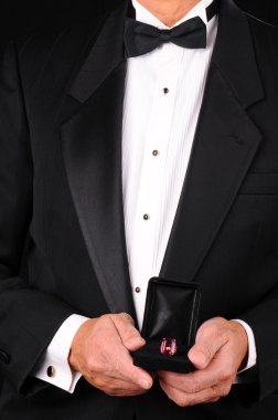 Man in Tuxedo Holding Ring Box clipart