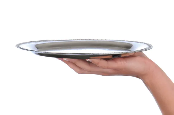 Woman's hand holding a silver tray — Stock Photo, Image