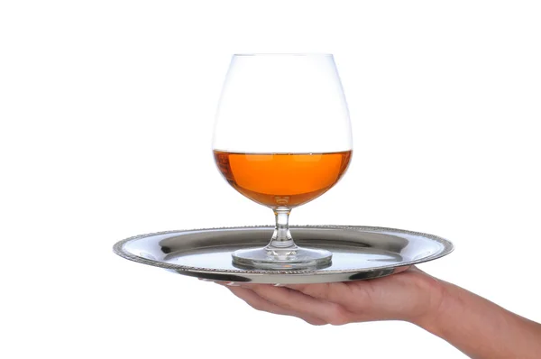 Brandy Snifter on tray held by womams hand — Stock Photo, Image