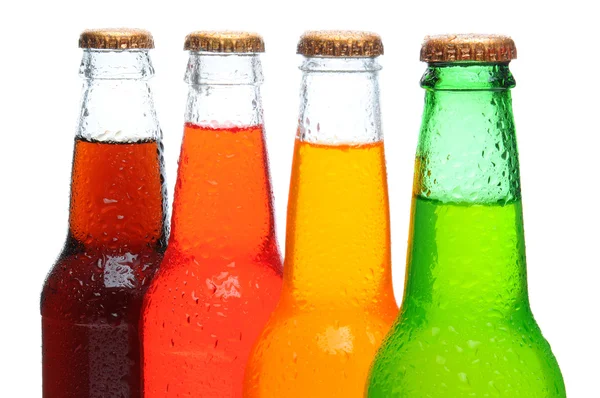 Primer plano de cuatro botellas de soda —  Fotos de Stock
