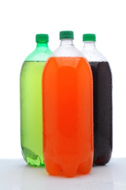 Three Two Liter Soda Bottles on Wet Counter clipart