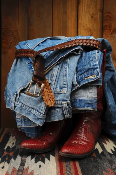 Blue Jeans draped over Cowboy Boots