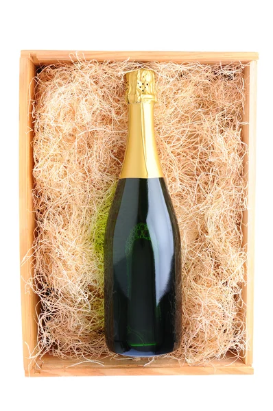 Champagneflaska i trä låda — Stockfoto