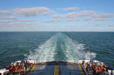 Ferry Boat leaving UK land from Dover to Calais clipart