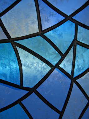 Stained glass background with ice flowers clipart