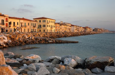 Marina di Pisa sunset view of the town clipart