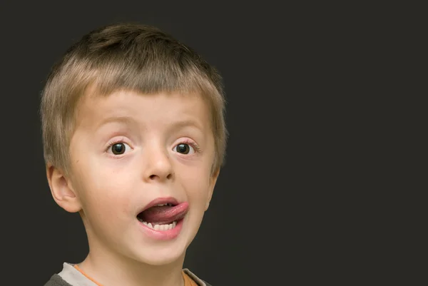 Boy sticking out his tongue — Stock Photo, Image