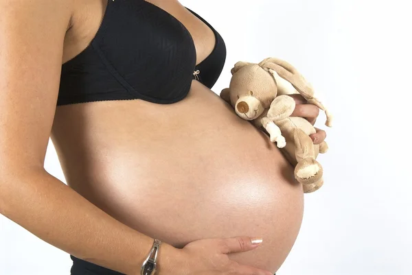 Gravid kvinna med leksak — Stockfoto