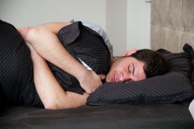 Portrait of a young male sleeping clipart