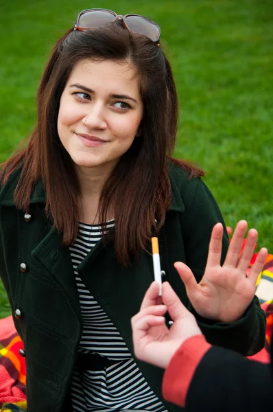 Young female rejects smoking offer — Stock Photo, Image