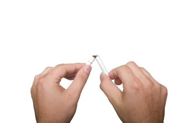 Close-up view of man breaking cigarette — Stock Photo, Image