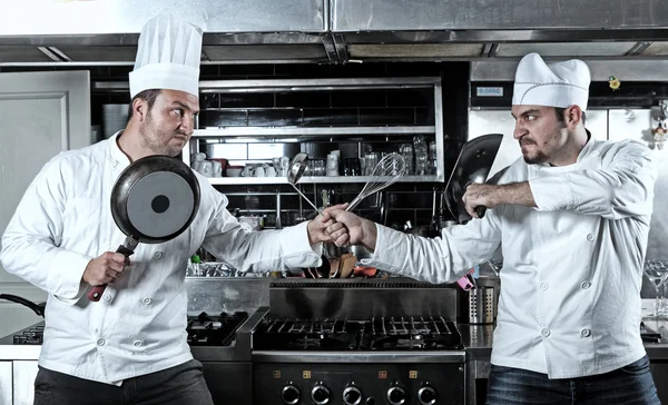Portrait of two chefs fighting — Stock Photo, Image