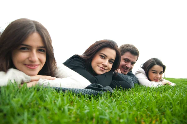 Young relaxing and lying on the grass — Stock Photo, Image