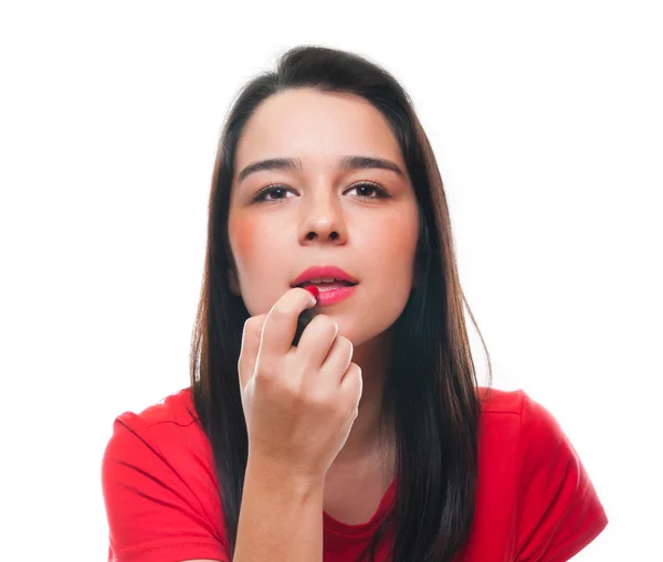 Beautiful young female applying her lipstick — Stock Photo, Image