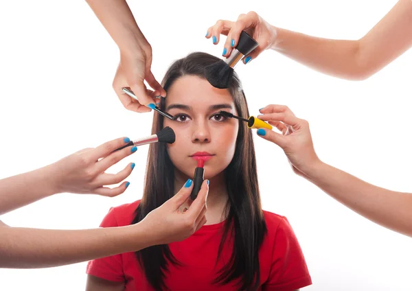 Beautiful young female getting her make-up done — Stock Photo, Image