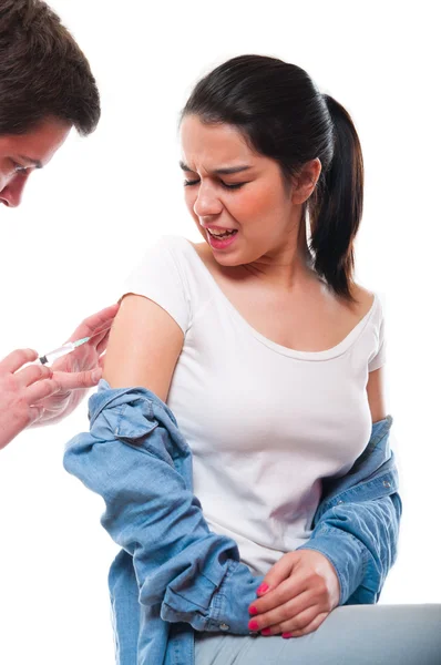 Beautiful young female getting vaccination — Stock Photo, Image
