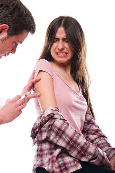 Beautiful young female getting vaccination — Stock Photo, Image