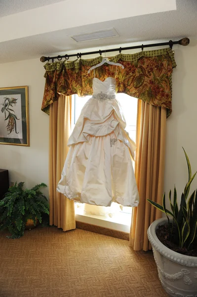 Wedding dress hanging up — Stock Photo, Image