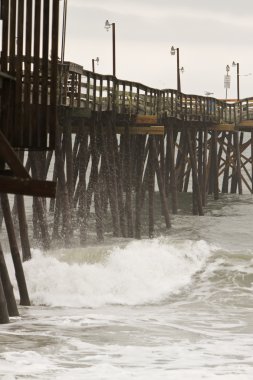 Pier and waves at the North Carolina Outer Banks clipart