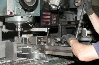 Drilling and milling CNC in workshop clipart