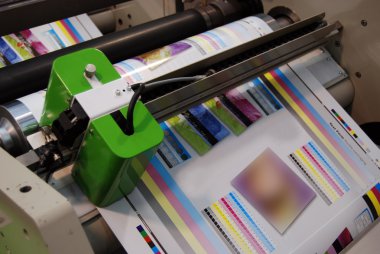 Industrial printshop: Flexo press printing clipart