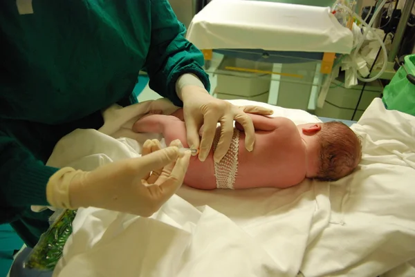 Newborn: first injection — Stock Photo, Image