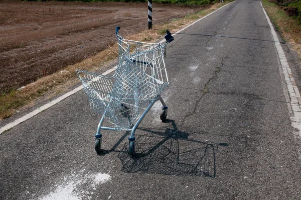 Broken shopping cart in a street campaign — Stock Photo, Image
