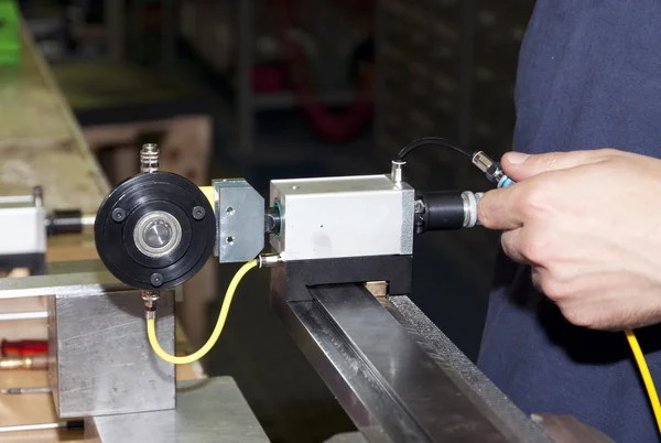 Hands performing a machining precision — Stock Photo, Image