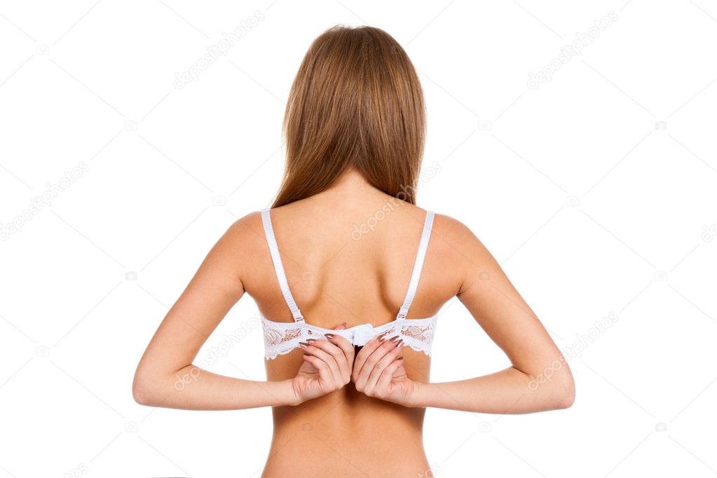 Young woman taking off her bra