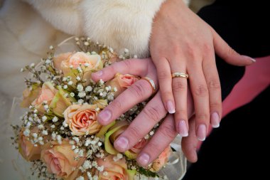 Wedding rings and flowers. clipart