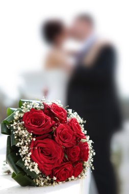 Newly-married couple and wedding bouquet. clipart