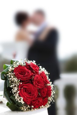 Newly-married couple and wedding bouquet. clipart